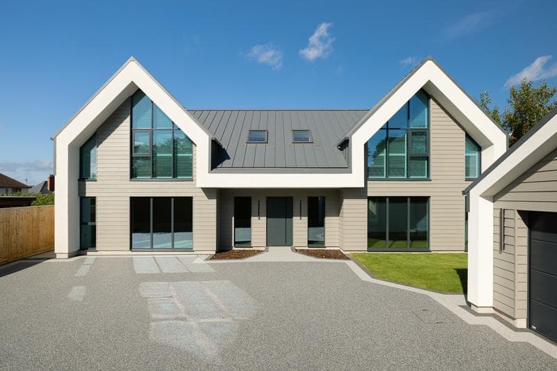 Front view of modern residence with PLX roofing